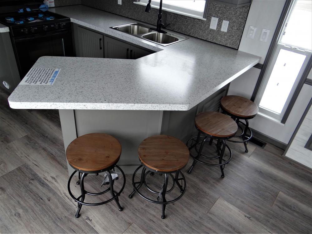 Extended Counter Top with 8" Longer Overhang in Leche Vesta & Added Bar Stool