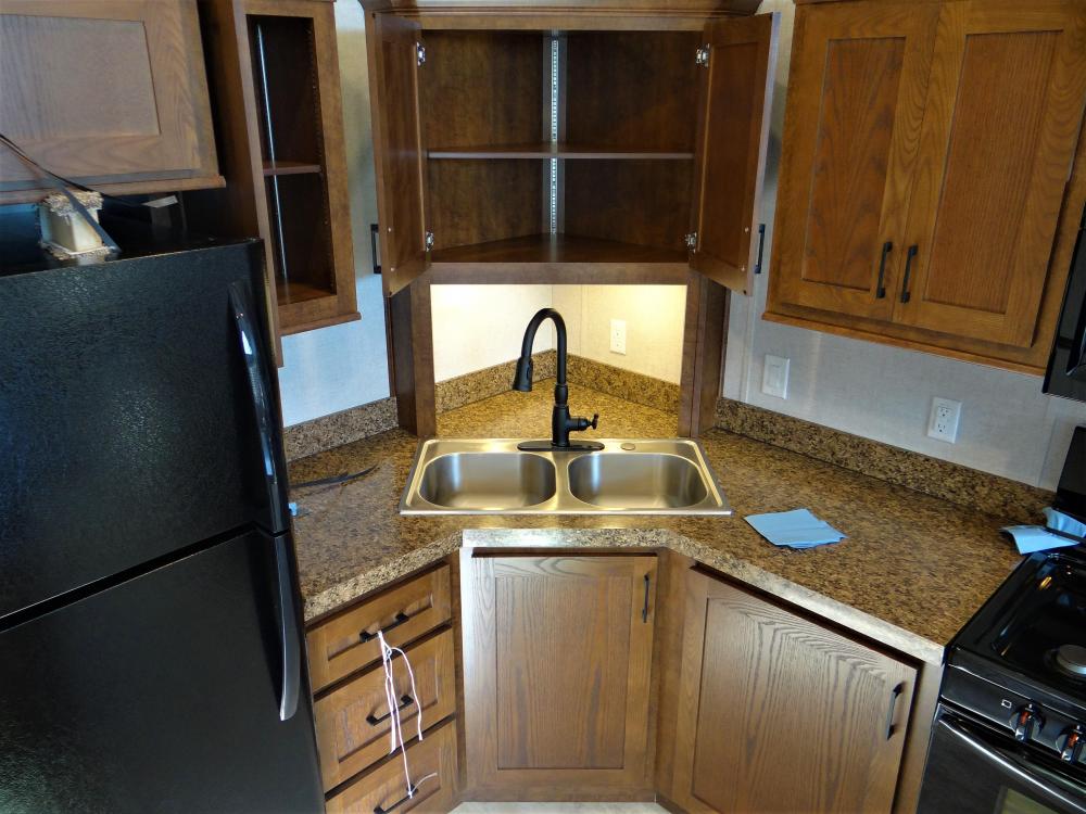 Corner Cabinet with Solid Wood instead of Glass Insert. Stainless Double Sink & Single Lever Faucet with Pull Down Sprayer Standard